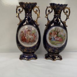 A pair of Cobalt blue antique vases decorated with scenes based on the work of Angelica Kaufmann